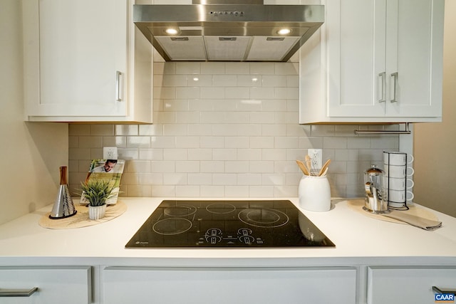 1658 Koch Ct, Charlottesville, VA 22911 - kitchen with white cabinets, extractor fan, black electric stovetop, light countertops, and tasteful backsplash