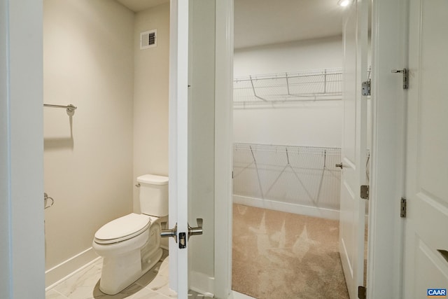 1658 Koch Ct, Charlottesville, VA 22911 - bathroom featuring toilet, baseboards, visible vents, and a walk in closet