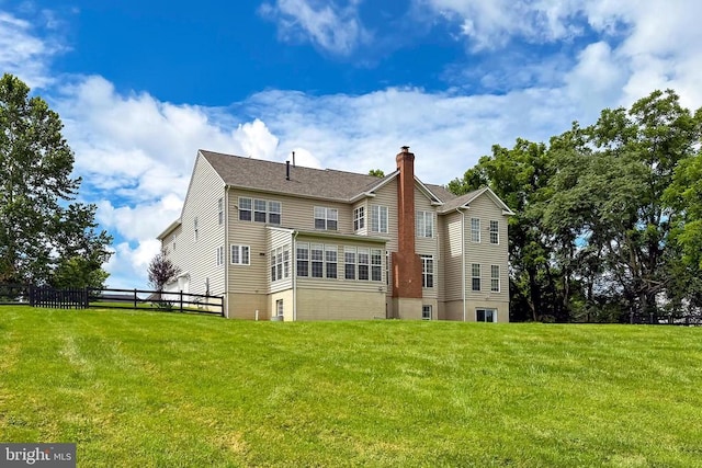  - back of house with a chimney