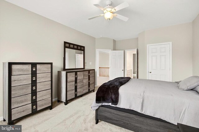  - carpeted bedroom with ceiling fan and ensuite bath