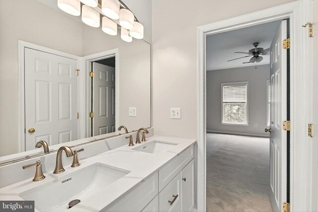  - bathroom featuring double vanity and a ceiling fan
