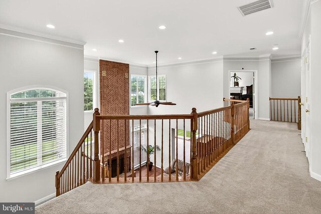  - corridor featuring an upstairs landing, carpet, crown molding, and recessed lighting