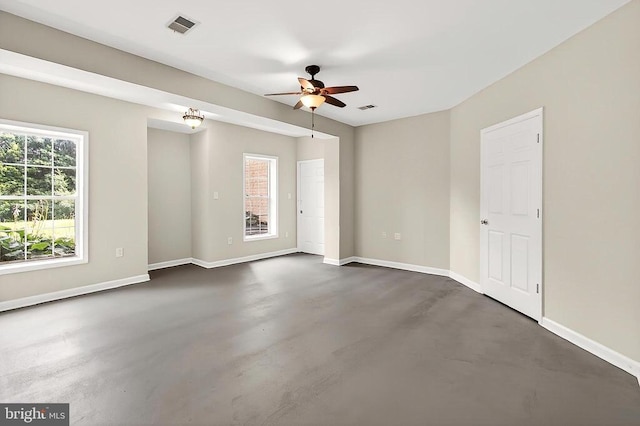  - spare room with finished concrete flooring and a ceiling fan