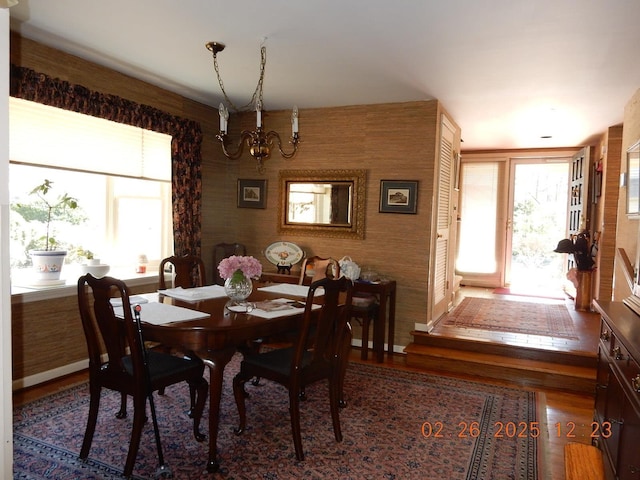 49 Edgewood Ct, Hot Springs, VA 24445 - dining area featuring wood finished floors, baseboards, and a notable chandelier