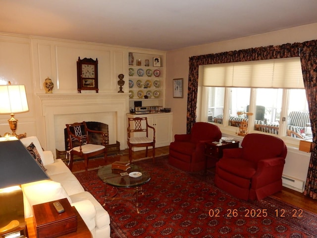 49 Edgewood Ct, Hot Springs, VA 24445 - living room featuring a baseboard radiator and a fireplace