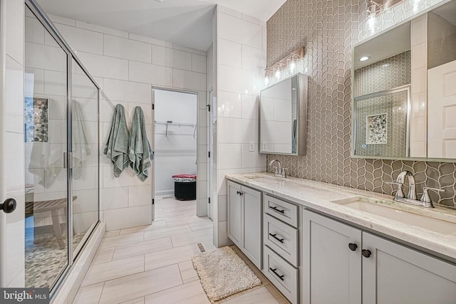 295 Hemlock Loop, Mineral, VA 23117 - full bathroom with a stall shower, tile walls, double vanity, and a walk in closet
