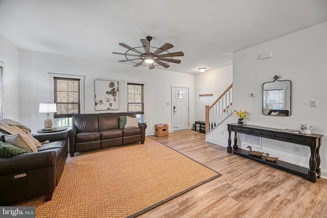 295 Hemlock Loop, Mineral, VA 23117 - living area with wood finished floors, stairs, a ceiling fan, and baseboards