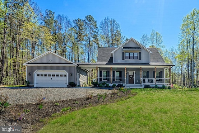 295 Hemlock Loop, Mineral, VA 23117 - craftsman-style house featuring gravel driveway, a front lawn, a porch, board and batten siding, and an attached garage