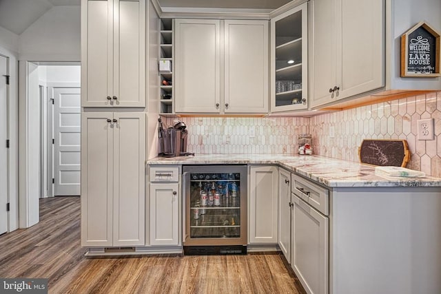295 Hemlock Loop, Mineral, VA 23117 - bar area with beverage cooler, light wood-style floors, and backsplash