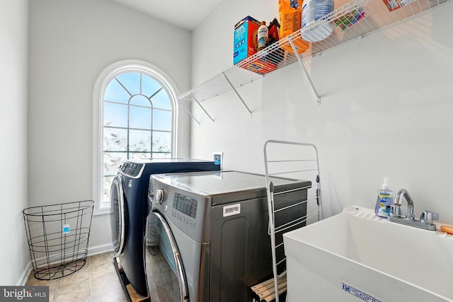  - washroom with washer and clothes dryer and baseboards