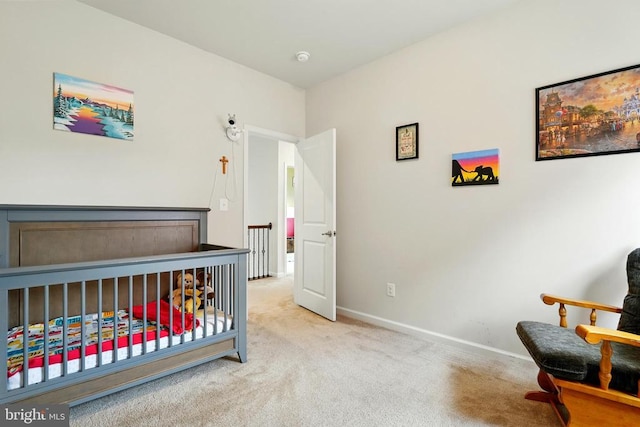  - bedroom with light carpet and baseboards