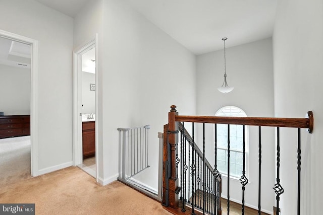  - staircase with carpet floors and baseboards