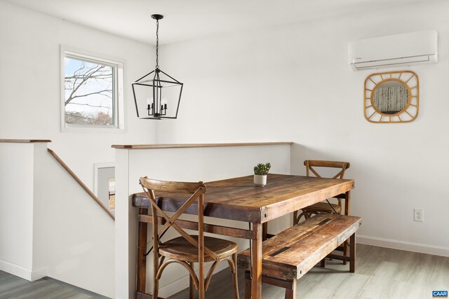 1795 Avon Rd, Afton, VA 22920 - dining space with a wall mounted air conditioner, wood finished floors, baseboards, and a chandelier
