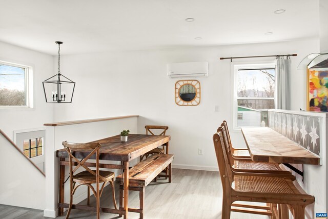 1795 Avon Rd, Afton, VA 22920 - dining space with light wood finished floors, a wall mounted AC, a chandelier, baseboards, and recessed lighting