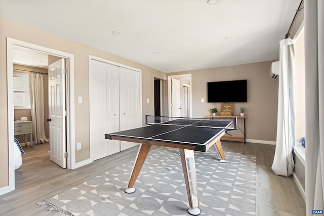 1795 Avon Rd, Afton, VA 22920 - playroom featuring light wood finished floors, baseboards, and a wall unit AC