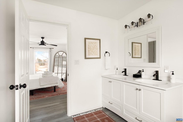 1795 Avon Rd, Afton, VA 22920 - ensuite bathroom featuring wood finished floors, double vanity, ceiling fan, and baseboards