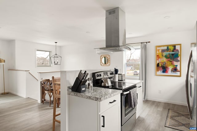 1795 Avon Rd, Afton, VA 22920 - kitchen featuring stainless steel range with electric stovetop, island range hood, light wood-style floors, and healthy amount of natural light