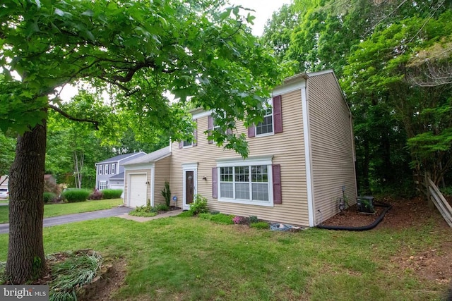 5903 Vista Ct, Fredericksburg, VA 22407 - view of front facade with a front yard, a garage, asphalt driveway, and central AC unit