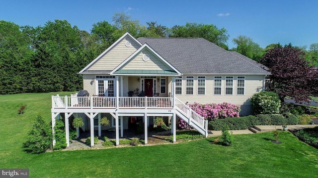 back of house with a lawn, french doors, stairs, a shingled roof, and a wooden deck