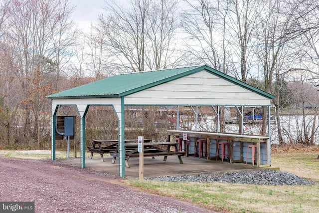 view of property's community featuring a detached carport