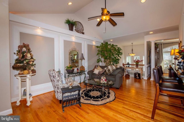 living room featuring ceiling fan, recessed lighting, light wood-type flooring, and vaulted ceiling