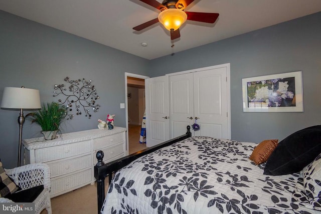 bedroom with carpet flooring, a closet, and ceiling fan