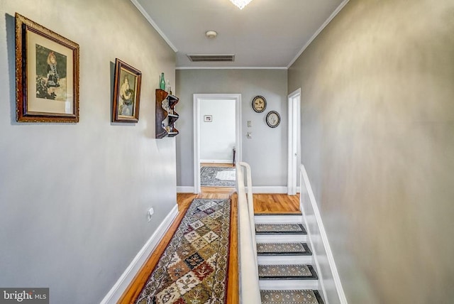 215 Fredericksburg Ave, Louisa, VA 23093 - hall with crown molding, baseboards, visible vents, and wood finished floors