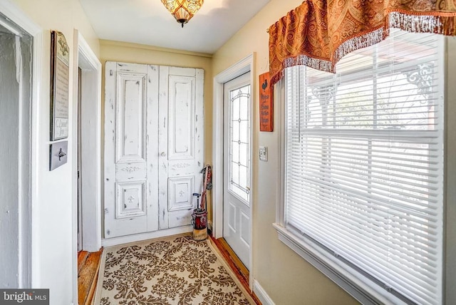 215 Fredericksburg Ave, Louisa, VA 23093 - doorway with baseboards and light wood-type flooring