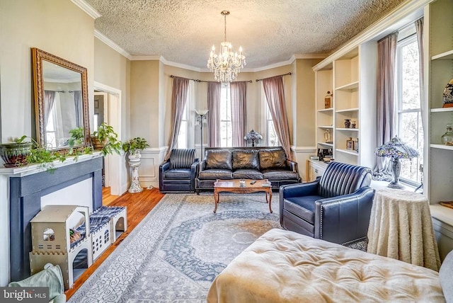 215 Fredericksburg Ave, Louisa, VA 23093 - sitting room with a chandelier, a textured ceiling, and crown molding