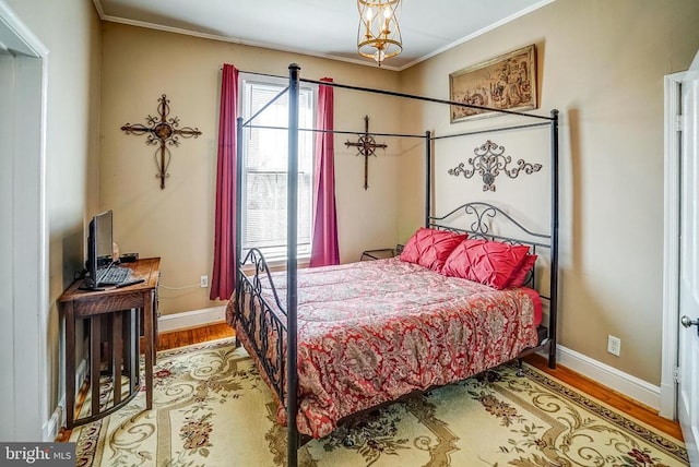 215 Fredericksburg Ave, Louisa, VA 23093 - bedroom featuring baseboards, ornamental molding, and wood finished floors