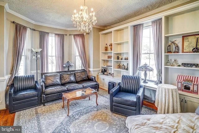 215 Fredericksburg Ave, Louisa, VA 23093 - sitting room with a chandelier, crown molding, a textured ceiling, and wood finished floors