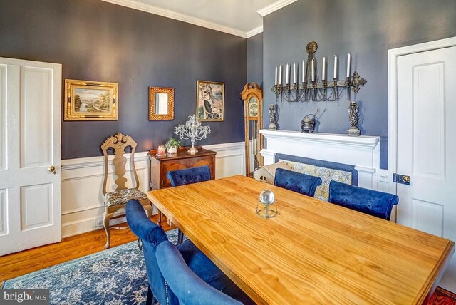 215 Fredericksburg Ave, Louisa, VA 23093 - dining room with wainscoting, crown molding, and wood finished floors