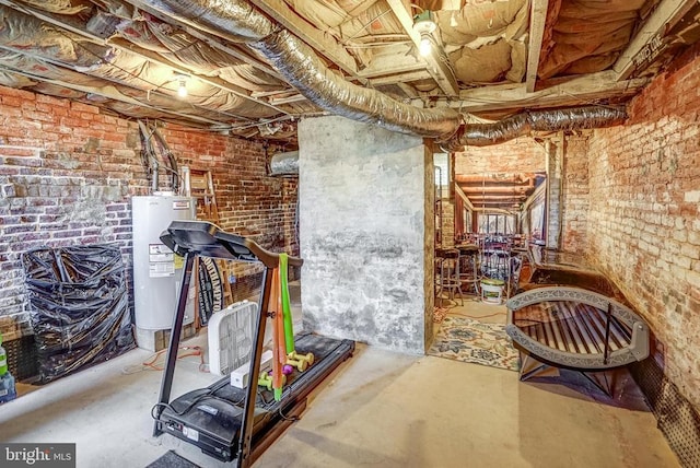 215 Fredericksburg Ave, Louisa, VA 23093 - unfinished basement featuring water heater and brick wall