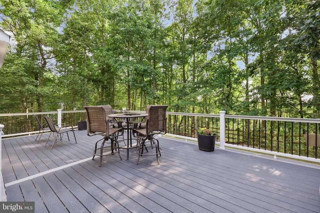 2357 Brighton Pl, Jeffersonton, VA 22724 - wooden terrace featuring outdoor dining area and view of wooded area