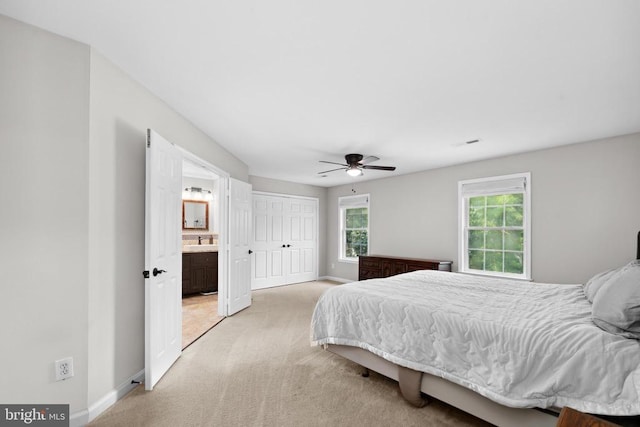 2357 Brighton Pl, Jeffersonton, VA 22724 - bedroom featuring light colored carpet, connected bathroom, ceiling fan, and a closet