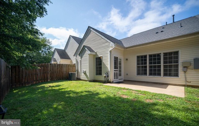 11313 Macon Dr, Fredericksburg, VA 22407 - back of property featuring a patio area and a shingled roof