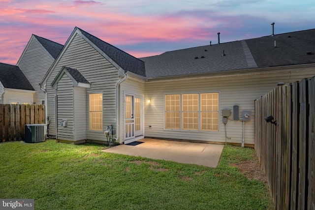 11313 Macon Dr, Fredericksburg, VA 22407 - back of house at dusk featuring a patio area