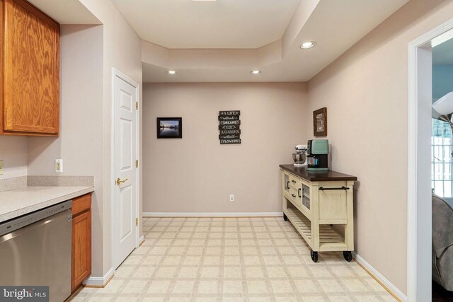 11313 Macon Dr, Fredericksburg, VA 22407 - kitchen with stainless steel dishwasher, recessed lighting, light floors, brown cabinets, and light countertops