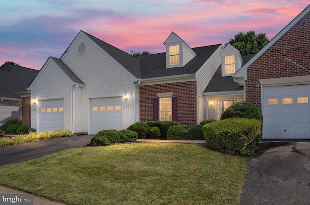 11313 Macon Dr, Fredericksburg, VA 22407 - traditional-style home featuring brick siding, a yard, an attached garage, asphalt driveway, and roof with shingles