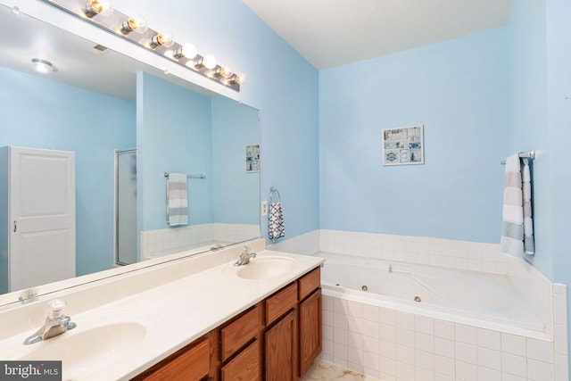 11313 Macon Dr, Fredericksburg, VA 22407 - full bath with a tub with jets, double vanity, and a stall shower