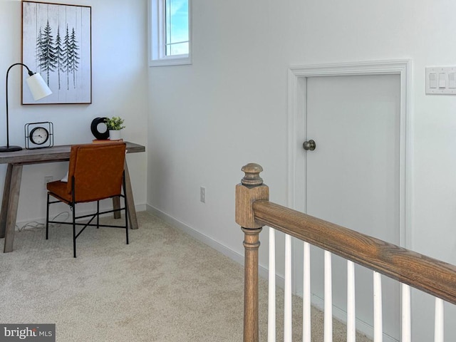 office featuring baseboards and carpet flooring