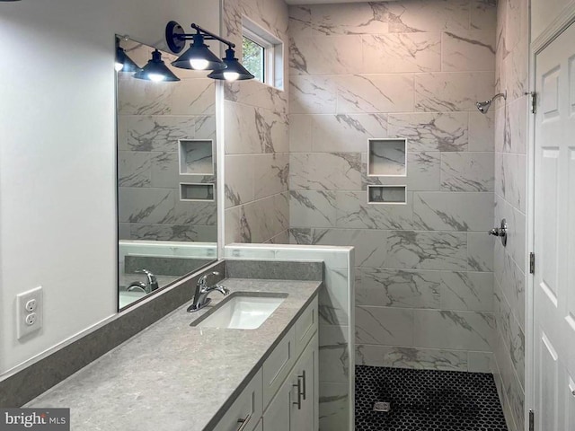 bathroom featuring vanity and a tile shower