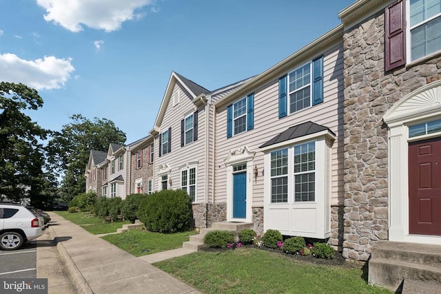 3103 Alliance Ct, Fredericksburg, VA 22408 - townhome / multi-family property with stone siding, a standing seam roof, and entry steps