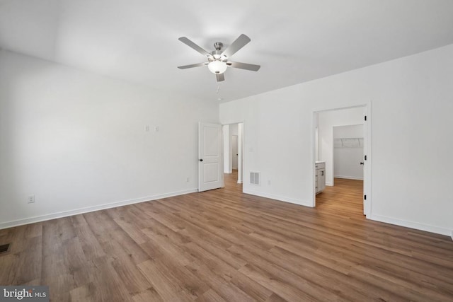 201 Zion Manor Rd Lot 13, Gordonsville, VA 22942 - unfurnished bedroom featuring wood finished floors, baseboards, a walk in closet, and ceiling fan