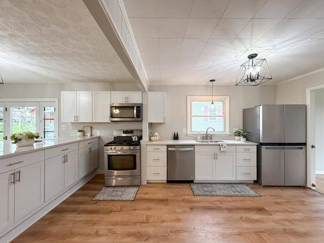 6 Maple Dr, Verona, VA 24482 - kitchen with a sink, white cabinetry, light countertops, and appliances with stainless steel finishes