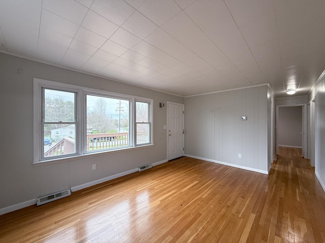 6 Maple Dr, Verona, VA 24482 - empty room featuring baseboards, ornamental molding, light wood-style flooring, and visible vents