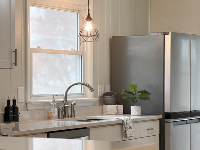 6 Maple Dr, Verona, VA 24482 - kitchen featuring freestanding refrigerator, decorative light fixtures, a sink, light countertops, and white cabinets