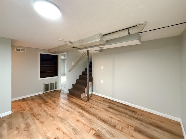 6 Maple Dr, Verona, VA 24482 - finished below grade area featuring wood finished floors, baseboards, and stairway