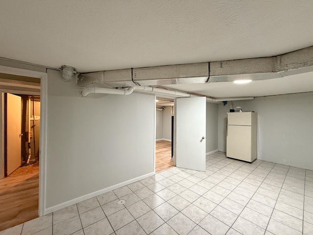 6 Maple Dr, Verona, VA 24482 - finished basement with freestanding refrigerator and light tile patterned floors