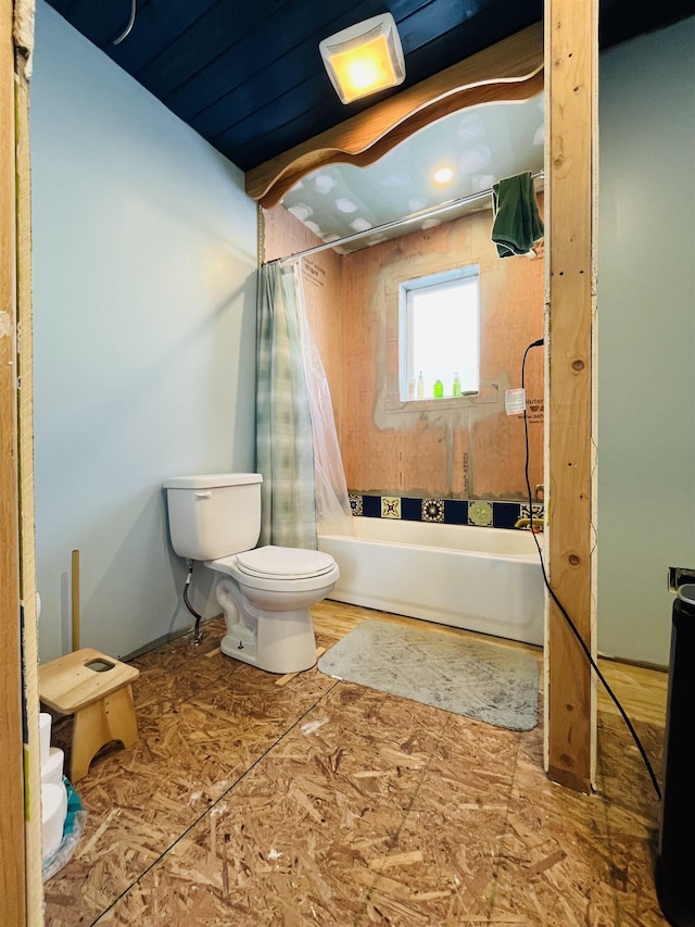 bathroom with shower / bath combo and toilet